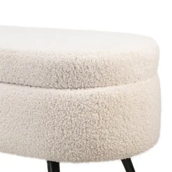 Metalen bank met witte krullen