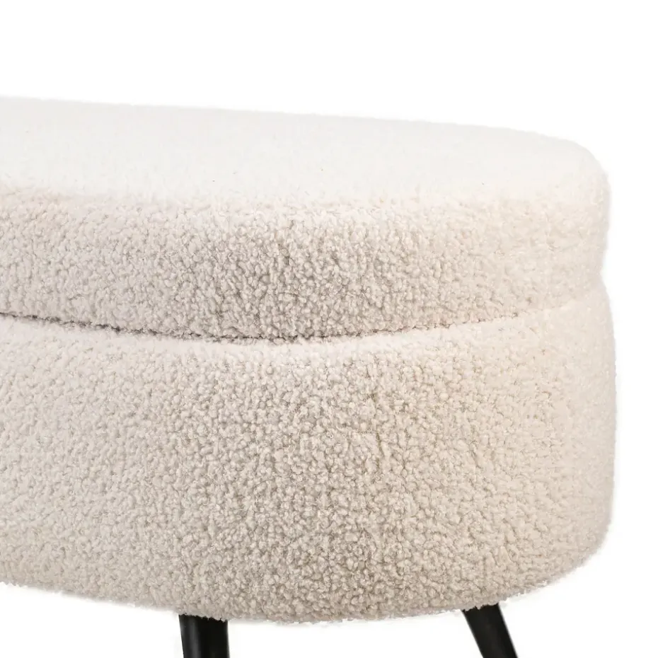 Metalen bank met witte krullen